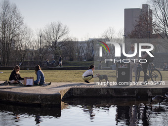   People soak up the spring sun, despite the national lockdown, at New Islington Marina in Manchester city centre on Tuesday 2nd March 2021....