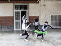 The nun Adela, director of the educational center, plays with several students during recess at the Nuestra Señora de Covadonga school, on M...