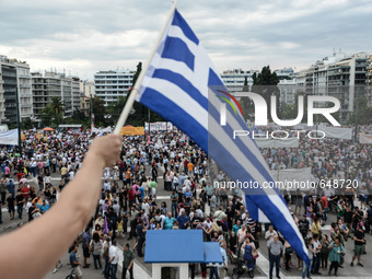 Demonstration organized by public sector union ADEDY, supporters of SYRIZA, and leftist organizations at Syntagma Square demanding the aboli...