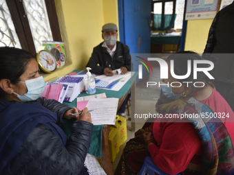 A Health worker counselling Nepalese People above 65 before getting first dose of COVID19 vaccines developed by Oxford- AstraZeneca Plc at B...