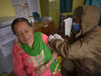 Nepalese People above 65 gets first dose of COVID19 vaccines developed by Oxford- AstraZeneca Plc at Bal Kumari Health Post, Kirtipur, Kathm...