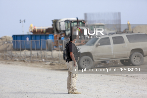 An officer directs traffic at a very busy SpaceX build site in Boca Chica, Texas on March 8, 2021.   