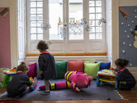 Children play on the first day of deflation, at the daycare center, after confinement on March 15, 2021, in Porto, Portugal. On March 11, th...