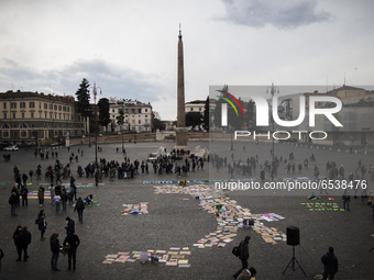 An image of Italy formed by signs placed on the ground is shown in Piazza del Popolo, Rome, as activist takes part in a Fridays For Future...