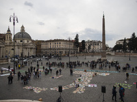 An image of Italy formed by signs placed on the ground is shown in Piazza del Popolo, Rome, as activist takes part in a Fridays For Future...