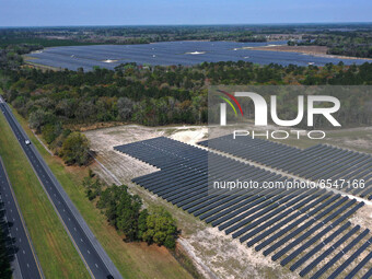 In this aerial view from a drone, the Florida Power & Light Echo River Solar Energy Center is seen alongside Interstate 10 on March 15, 2021...