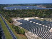 In this aerial view from a drone, the Florida Power & Light Echo River Solar Energy Center is seen alongside Interstate 10 on March 15, 2021...