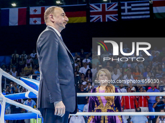 President of Azerbaijan Ilham Aliyev observes the national anthem  during the medal ceremony for the Men's Light Heavyweight 81kg final of t...