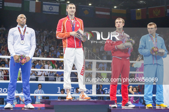 The silver medalist Valentino Manfredonia of Italy, gold medalist Teymur Mammadov of Azerbaijan and bronze medalists Pavel Silyagin of Russi...