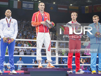 The silver medalist Valentino Manfredonia of Italy, gold medalist Teymur Mammadov of Azerbaijan and bronze medalists Pavel Silyagin of Russi...
