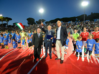 Italian FA president Carlo Tavecchio (L) stands with President CONI Giovanni Malagò (R) before the Italian women's futsal team's first ever...