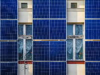 A number of solar collector panels are attached to the front wall of an old house in the center of Krakow, Poland on March 26, 2021. The rec...