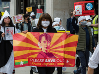 LONDON, UNITED KINGDOM - MARCH 31, 2021: Demonstrators march through central London to the Chinese Embassy in a protest against the military...