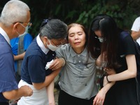 About a hundred people take part during a memorial ceremony mourning for the deaths of the train derailment, in Hualien, Taiwan, on April 4,...