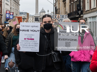 LONDON, UNITED KINGDOM - APRIL 03, 2021: Demonstrators take part in a protest march through central London against violence towards women an...