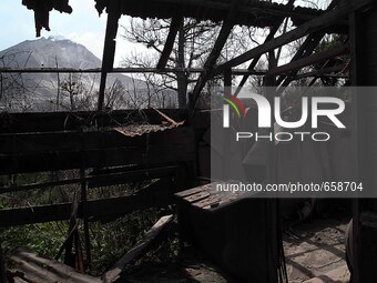 Sinabung volcano that burned villages abandoned the impact of the recent eruption, as seen from the village of Berastepu, North Sumatra, Ind...