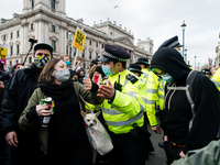 Police push protester back in London, Britain, 3 April 2021. Protests around the United Kingdom have been held in opposition to the Police,...