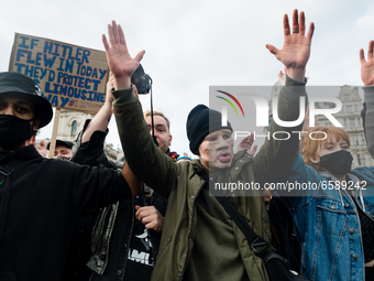 Protesters at a Kill the Bill protest raise hands in London, Britain, 3 April 2021. Protests around the United Kingdom have been held in opp...