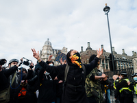 Protester at a Kill the Bill protest raises arms in London, Britain, 3 April 2021. Protests around the United Kingdom have been held in oppo...