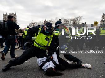 A woman is pinned down by Met Police during a Kill The Bill protest in London, Britain, 3 April 2021. Protests around the United Kingdom hav...