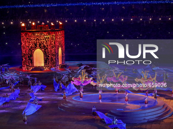 The dancers representing wind and water acting around the Ateshgah fire temple rised from the Main stage    during  the  Closing Ceremony of...