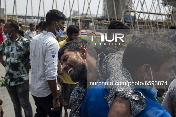 A man burst into tears after find out both of his parents got killed in the boat crush at Shitalakshya River, in Narayanganj on April 5, 202...