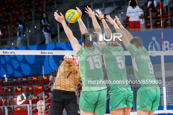 Todor ALEKSIEV (15),Svetoslav GOTSEV (5) and Dobromir DIMITROV (9) of Bulgaria are jumping on the net on the hit of Christian FROMM (1) of G...