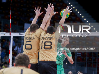 Michael ANDREI (18) and Denys KALIBERDA (6) of Germany are jumping on the net on the hit of Jani
JELIAZKOV (12) of Bulgaria  in the match Ge...