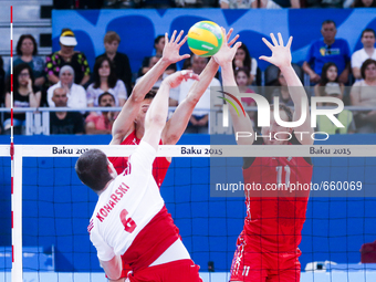 Igor FILIPPOV (11) and Victor POLETAEV (16) of Russia are jumping on the net on the hit of Dawid KONARSKI (6) of Poland  in the match Poland...