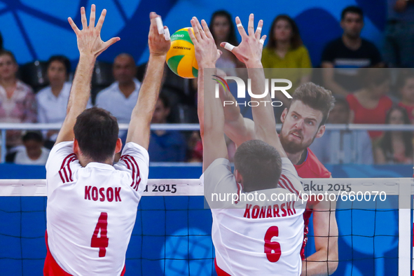 Dawid KONARSKI (6) and Grzegorz KOSOK (4) of Poland are jumping on the net on the hit of Egor KLIUKA  (18) of Russia  in the match Poland -...