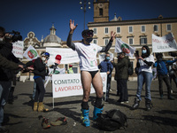 People take part in a demonstration organized by restaurant owners, entrepreneurs and small business owners to protest against the COVID-19...