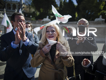 Italian actress Sandra Milo (C) takes part in a demonstration organized by restaurant owners, entrepreneurs and small business owners to pro...