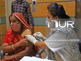 A beneficiary receives a dose of COVID-19 vaccine, at a camp  in Jaipur,Rajasthan, India, Thursday, April 8, 2021.(