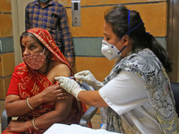 A beneficiary receives a dose of COVID-19 vaccine, at a camp  in Jaipur,Rajasthan, India, Thursday, April 8, 2021.(