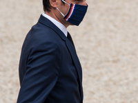 Government spokesman Gabriel Attal leaves the Elysée Palace after the Council of Ministers to go to the room where the press conference, lar...