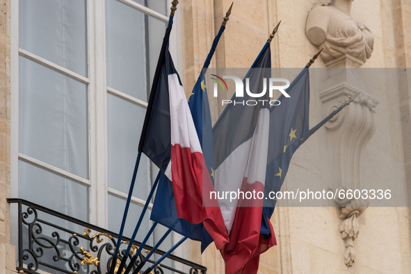 The French and European flags at the entrance to the Elysée Palace, home of the Presidency of the Republic, in Paris, on April 8, 2021. 
