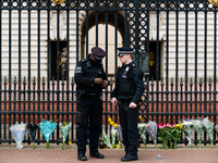 Police outside Buckingham Palace after it was announced that Britain's Prince Philip, husband of Queen Elizabeth, has died at the age of 99,...