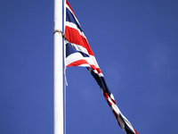 A Union Flag flies at half-mast from Glasgow City Chambers over George Square on April 9, 2021 in Glasgow, Scotland. The Queen has announced...