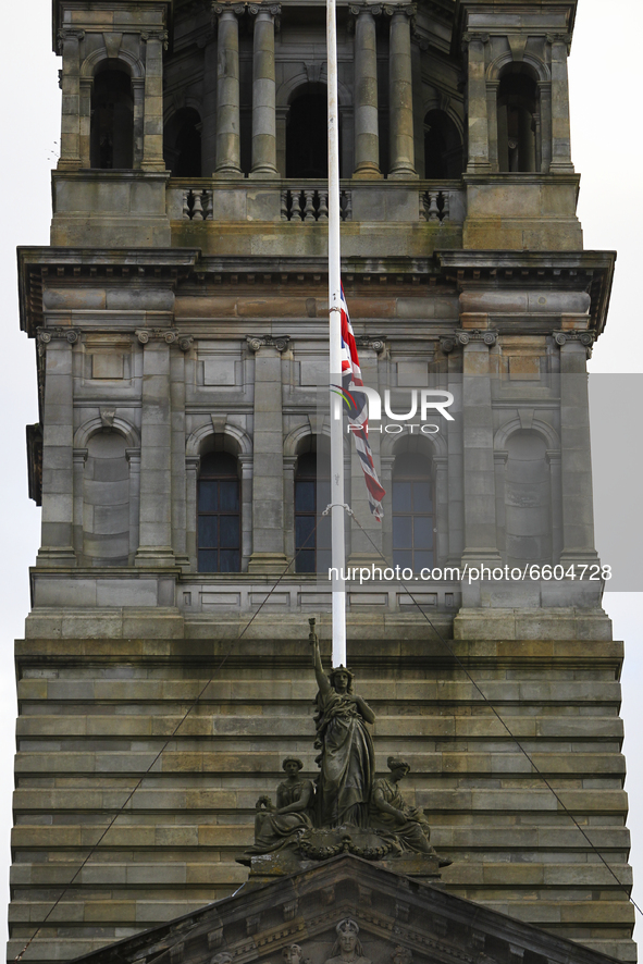 A Union Flag flies at half-mast from Glasgow City Chambers over George Square on April 9, 2021 in Glasgow, Scotland. The Queen has announced...
