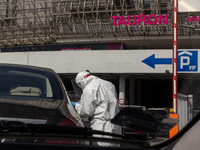 Health worker performs  the PCR Coronavirus  in a drive thru testing site at Touron Arena on April 9, 2021 in Krakow, Poland. Number of Covi...