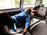 A Covid-19 patient wait inside an ambulance in front of Dhaka Medical College Hospital for treatment in Dhaka, Bangladesh, on April 09, 2021...