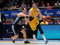 Kevin Pangos (L) of Zenit St Petersburg and Oz Blayzer of Maccabi Playtika Tel Aviv in action during the EuroLeague Basketball match between...