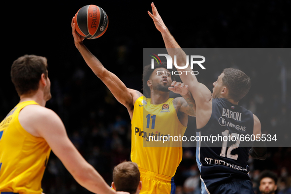 Tyler Dorsey (C) of Maccabi Playtika Tel Aviv in action against Billy Baron (R) of Zenit St Petersburg during the EuroLeague Basketball matc...