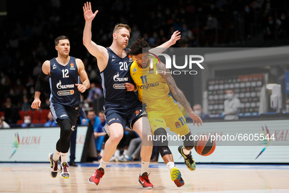 Tyler Dorsey (R) of Maccabi Playtika Tel Aviv in action against  Andrey Zubkov (20) of Zenit St Petersburg during the EuroLeague Basketball...