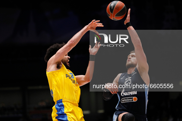 Mateusz Ponitka (R) of Zenit St Petersburg intercepts a pass by Elijah Bryant (L) of Maccabi Playtika Tel Aviv during the EuroLeague Basketb...