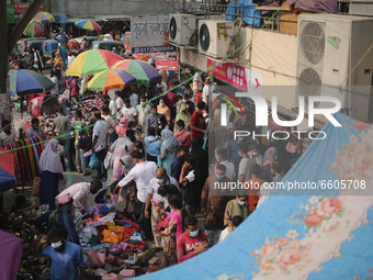 People gather at Dhaka New market for shopping as they not maintaining any kind of social distance in Dhaka, Bangladesh on April 09, 2021....