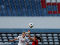 Nelli Korovkina  of Russia (L) vies with Carole Costa of Portugal during the UEFA Women's EURO 2022 play-off first leg match between Portuga...