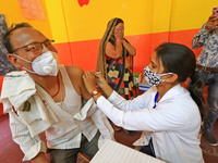 A beneficiary receives a dose of COVID-19 vaccine, at a camp  in Jaipur,Rajasthan, India, Saturday, April 10, 2021.(