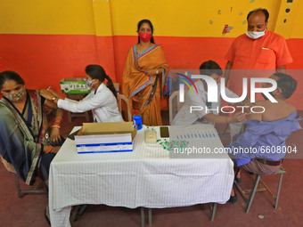 Beneficiaries receives a dose of COVID-19 vaccine, at a camp  in Jaipur,Rajasthan, India, Saturday, April 10, 2021.(