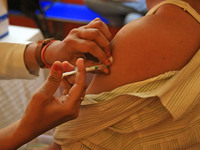 A beneficiary receives a dose of COVID-19 vaccine, at a camp  in Jaipur,Rajasthan, India, Saturday, April 10, 2021.(